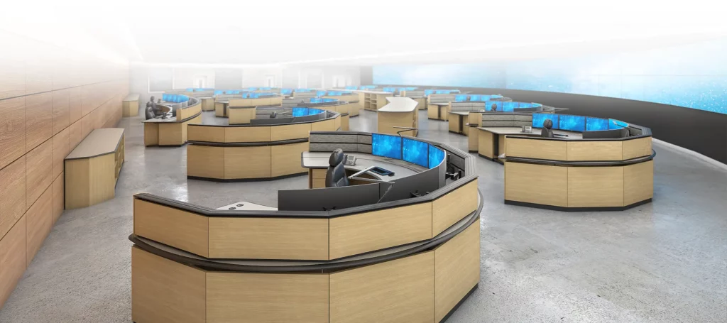 Tresco control room design with several individual workstations and a large widescreen back wall (with a white gradient from the top)