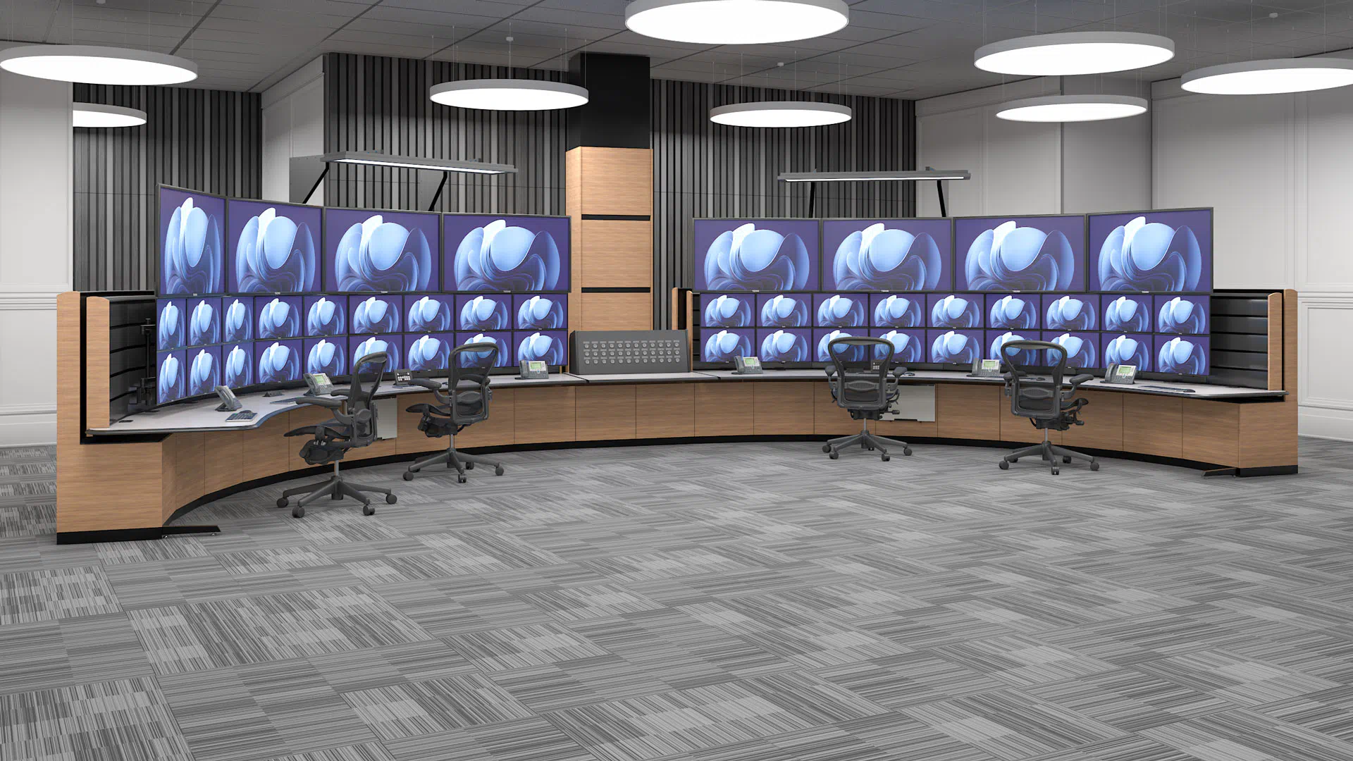 custom control room console, designed from the ground up for a company in the energy sector, With a multiple monitor array, 4 workstations and a central push-button control panel.